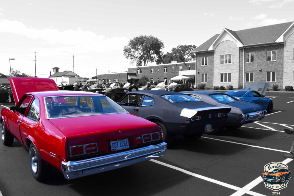 Line of muscle cars at the 2024 Mark My Word Car Show