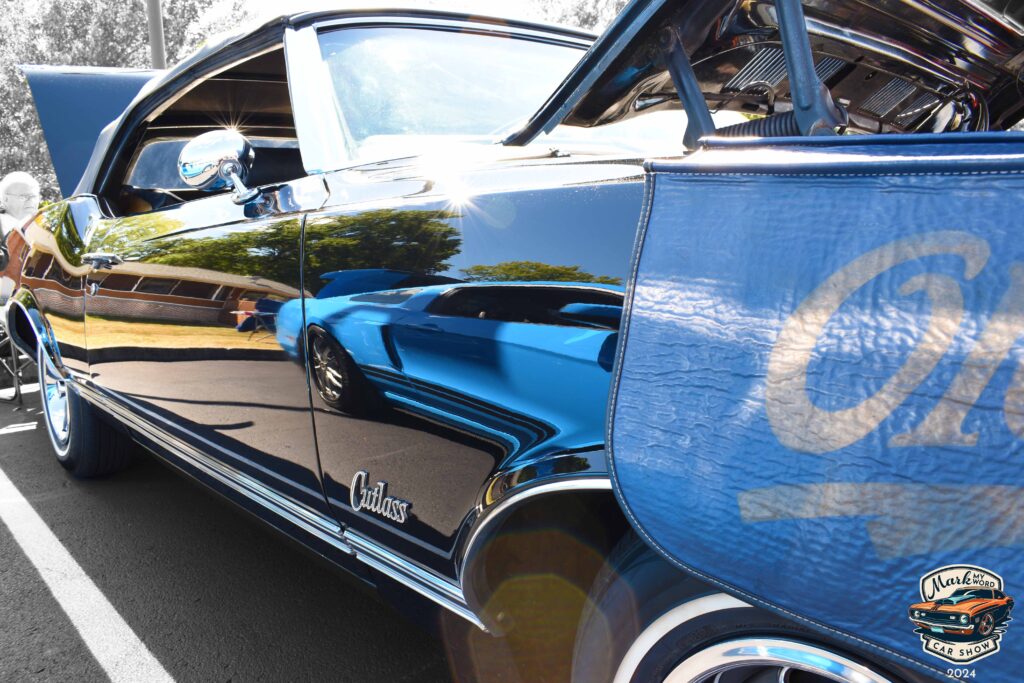 Glossy black 1970 Oldsmobile Cutlass convertible owned by Mary Lou Cutler, the original owner